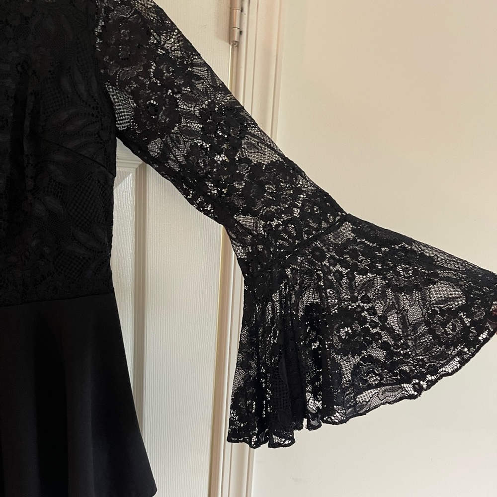 Peplum top with bell sleeves